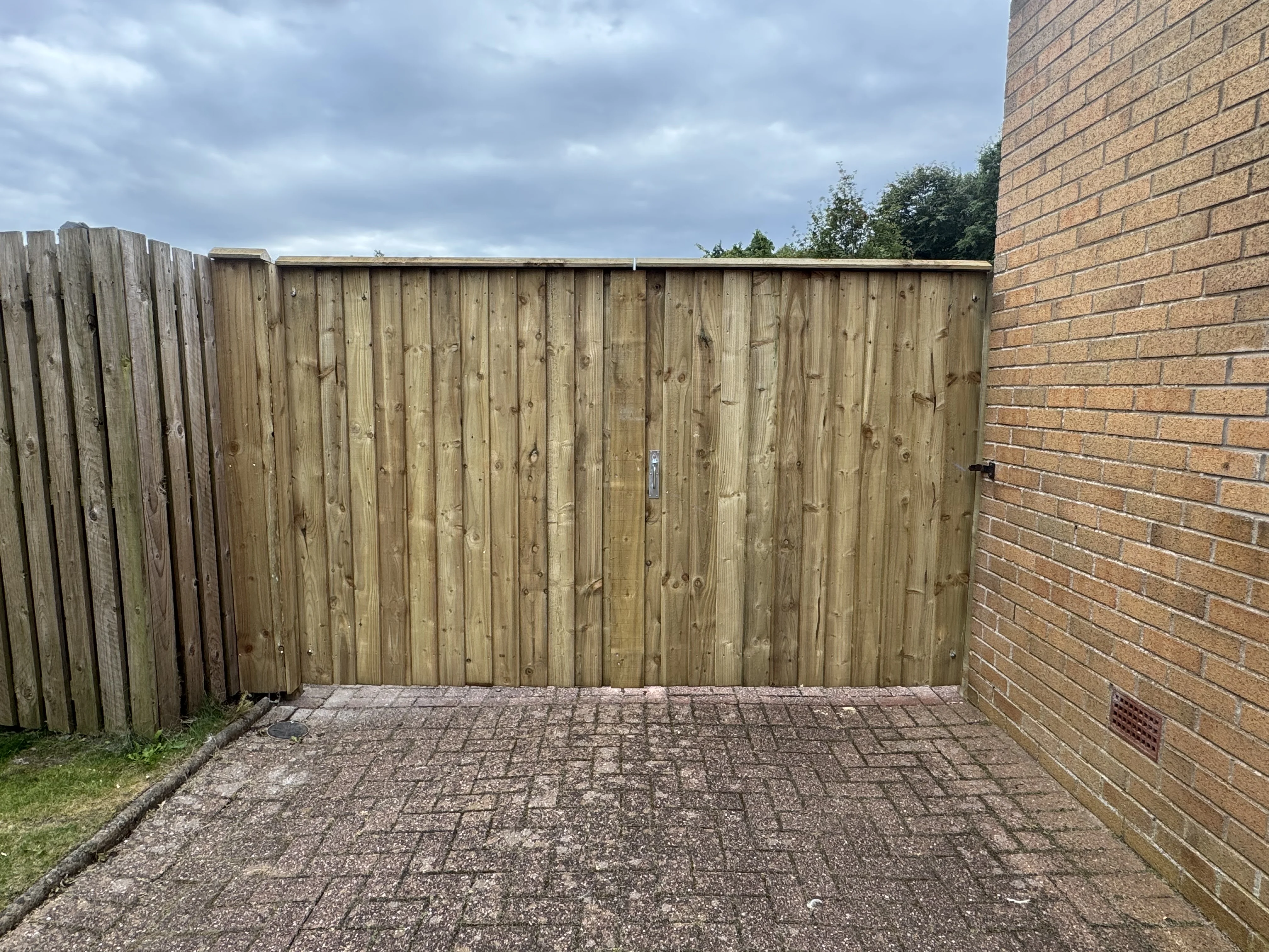Timber overlap fencing with coping and double gates project 2 completed in Irvine, Ayrshire