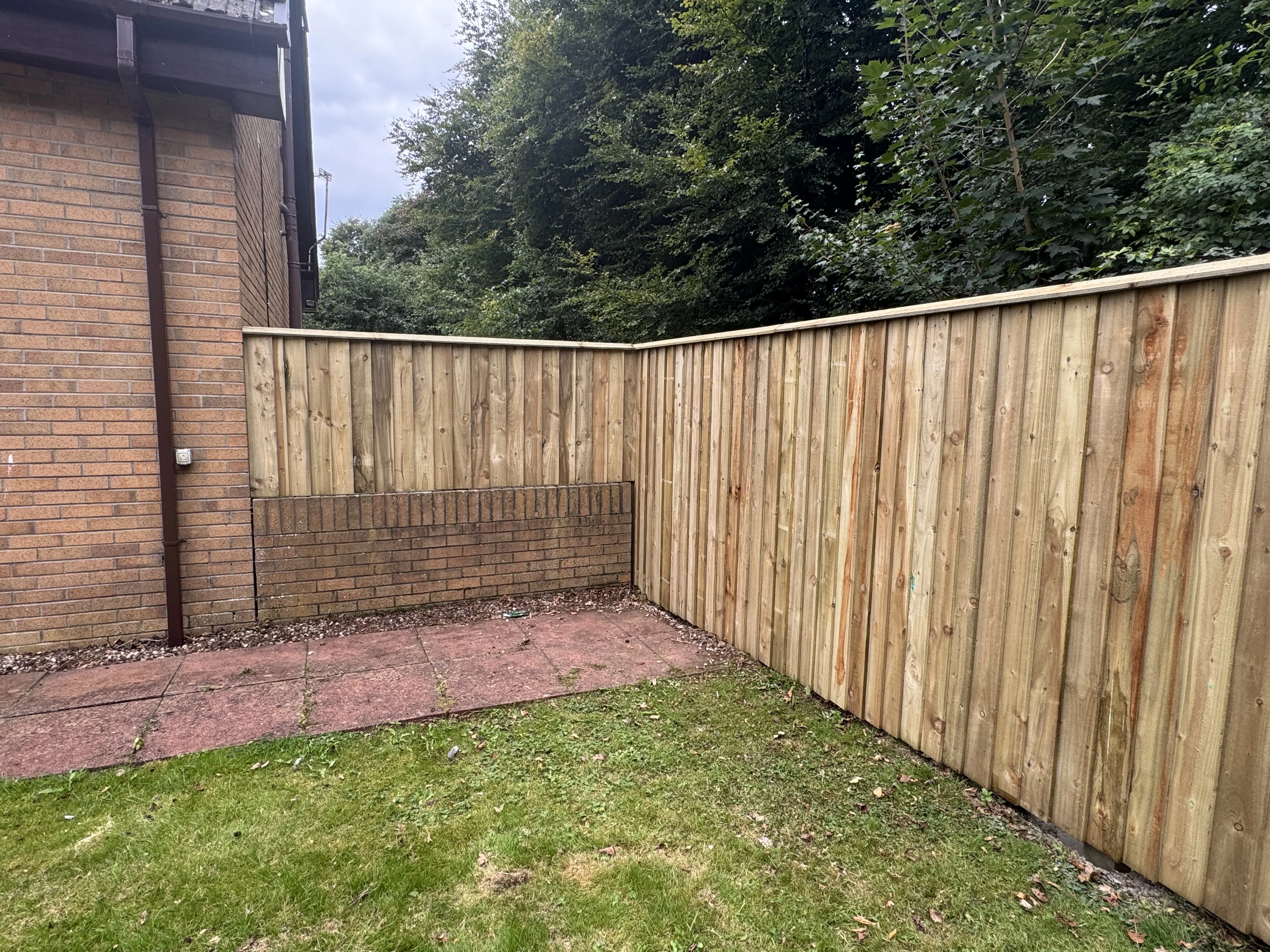 Timber overlap fencing with coping and double gates project 4 completed in Irvine, Ayrshire